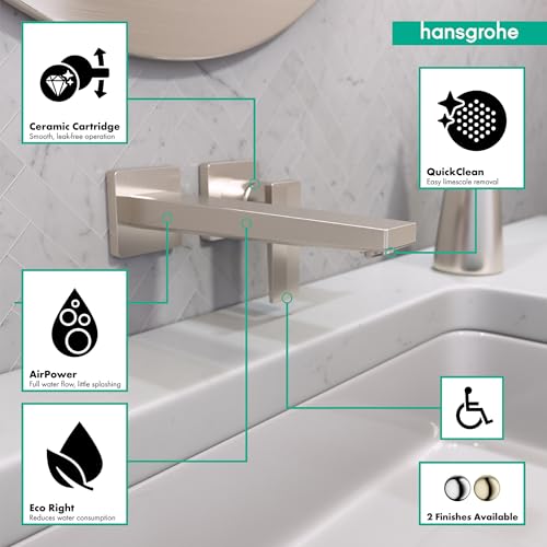 Brushed nickel wall-mounted single-handle bathroom faucet with lever handle and spout over white sink.