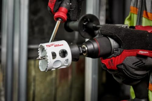 Milwaukee HOLE DOZER hole saw kit mounted on power drill with red and black handle grips.