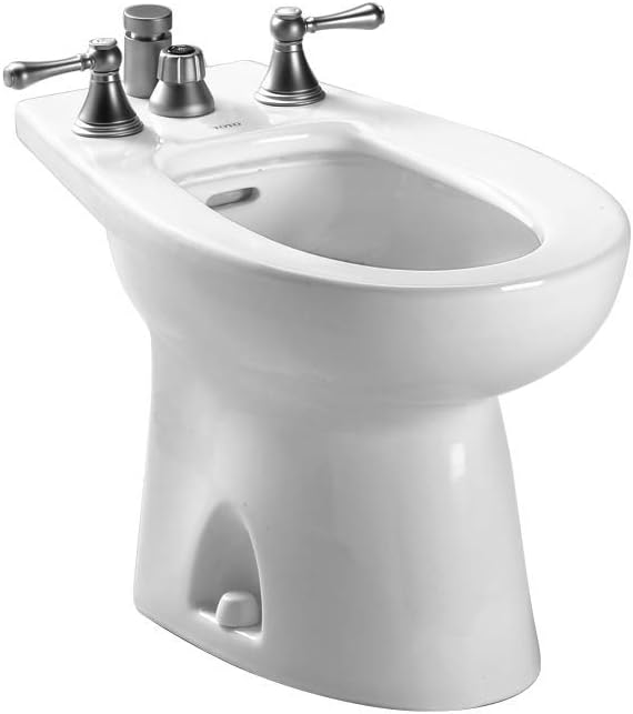 White ceramic bidet with deck-mount faucet featuring two lever handles and vertical spray nozzle.