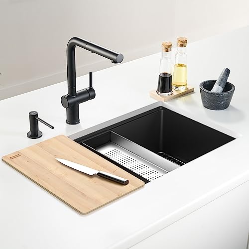 Light wood cutting board grid accessory positioned over black kitchen sink basin.