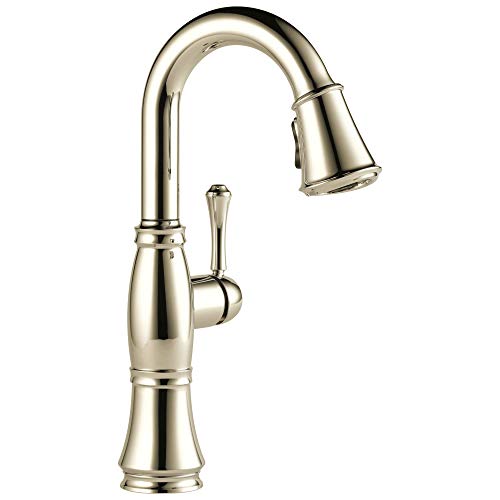 Polished nickel single-handle kitchen faucet with high arched spout and pull-down spray head.