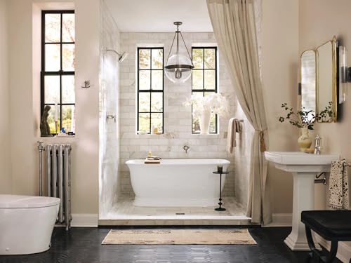 Polished nickel single-handle bathroom sink faucet with touchless motion sensor and curved spout.