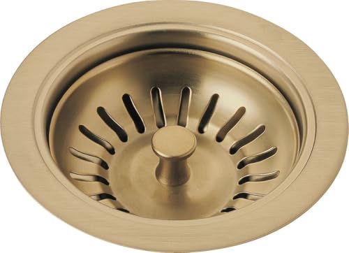Champagne bronze sink strainer with flange ring and vertical drain slots.