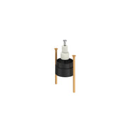 Grohe pressure balance extension kit with black cylindrical body, brass legs, and white cartridge assembly with chrome cap.