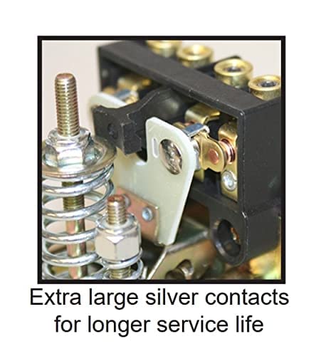 Heavy-duty pressure switch with large silver contacts and brass fittings, internal mechanical components visible.