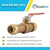 Brass push-to-connect ball valve with red lever handle on blue packaged background.