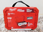 Red Milwaukee HOLE DOZER 15-piece hole saw kit in open carrying case with metal saw bits and accessories visible.