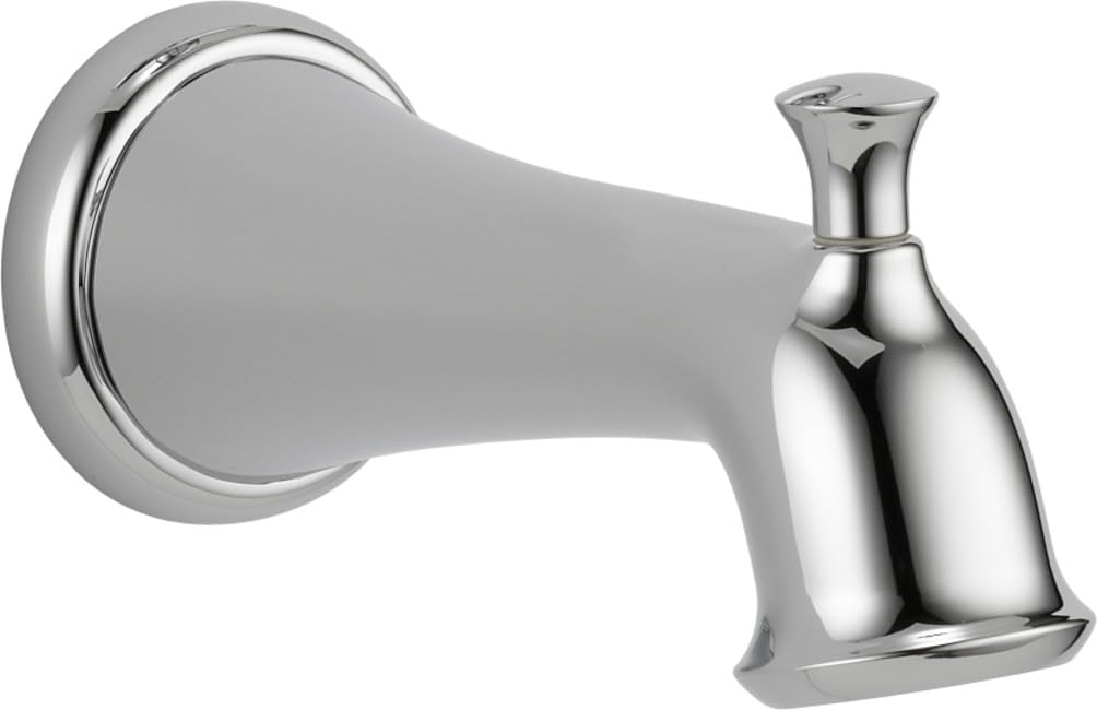 Chrome tub spout with pull-up diverter and wall-mounted escutcheon, featuring tapered spout design.