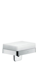 Chrome soap dispenser with white ceramic reservoir and integrated shelf below.