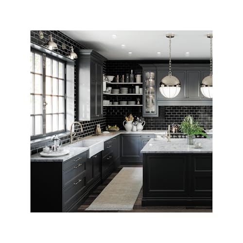 Polished nickel bar faucet with single handle mounted on kitchen sink counter in modern dark cabinetry setting.