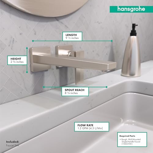 Brushed nickel wall-mounted bathroom faucet with single lever handle and rectangular spout over white sink.