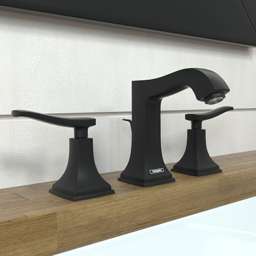 Matte black widespread bathroom faucet with curved central spout, two lever handles, and square base pedestals on wood counte