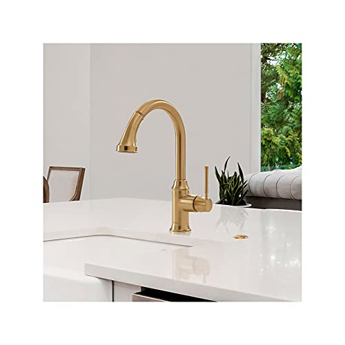 Hansgrohe Talis C brushed gold kitchen faucet with high arc spout and pull-down spray head installed on white countertop.