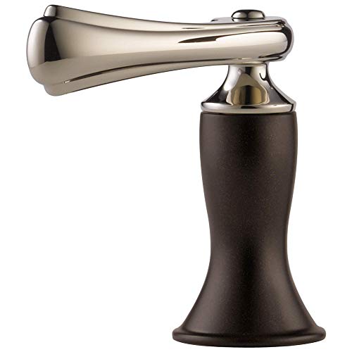 Polished nickel lever handle faucet with curved spout and dark bronze pedestal base for Roman tub installation.
