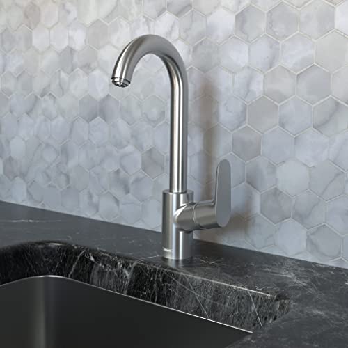 Steel pull-down bar faucet with curved spout and single lever handle mounted above dark countertop sink.