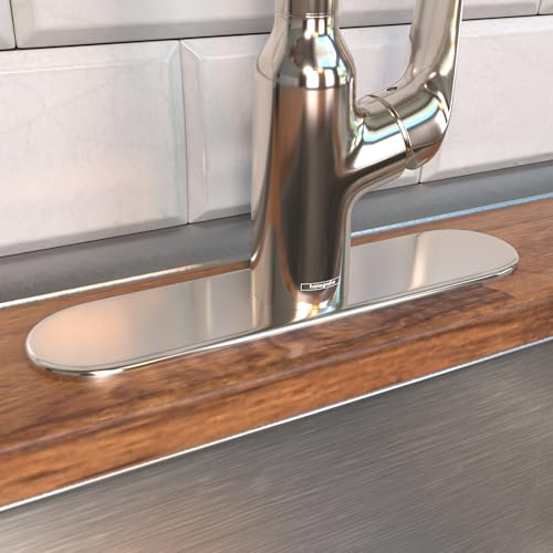 Polished nickel oval base plate for single-hole kitchen faucet mounted on wooden countertop.