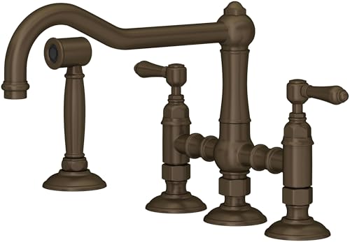 Tuscan brass bridge kitchen faucet with curved spout, side spray, and dual handles on round bases.