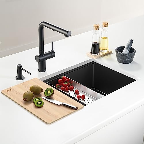 Natural wood cutting board with metal grid base fits inside kitchen sink basin.