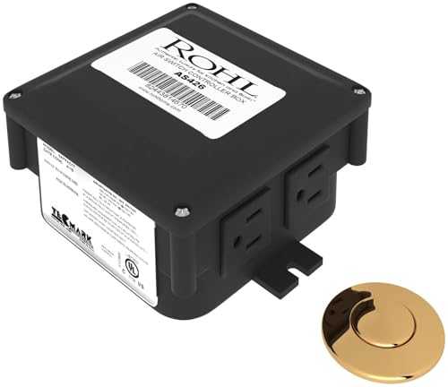 Black rectangular waste disposal control box with white label and unlacquered brass air switch button.