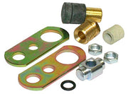 Assorted brass and metal hydrant parts including connector fittings, washers, nuts, and green metal mounting plates.