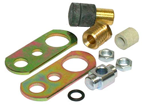 Assorted brass and metal hydrant parts including connector fittings, washers, nuts, and green metal mounting plates.