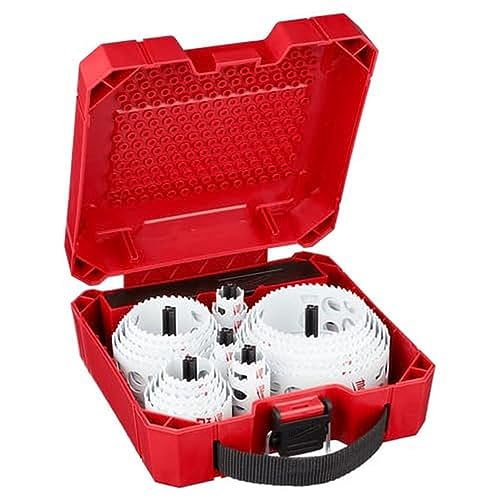 Red Milwaukee case open showing 28-piece hole saw kit with white circular saws and black arbors inside.