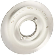Stainless steel circular escutcheon with temperature markings and central opening for faucet installation.