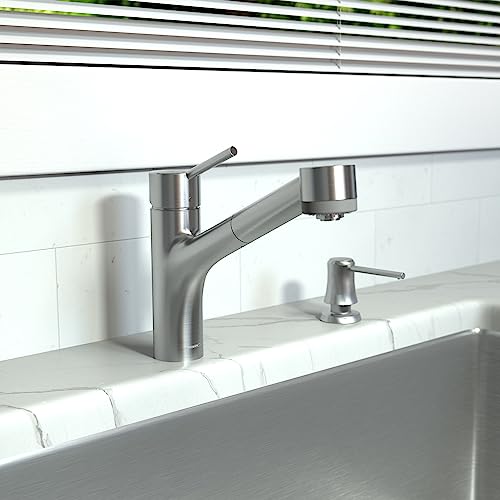 Steel optic kitchen faucet with pull-out spray head and matching soap dispenser installed on white subway tile backsplash.
