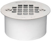 White PVC drain with stainless steel strainer grate and snap-in mounting holes on sides.