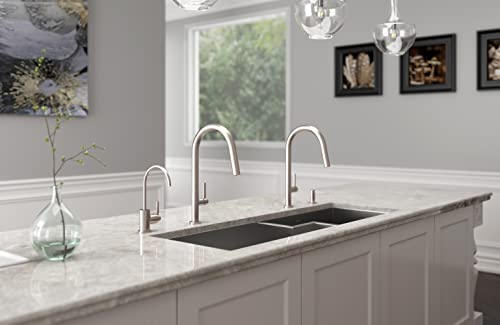 Satin nickel soap dispenser with curved spout mounted on white marble bathroom countertop.