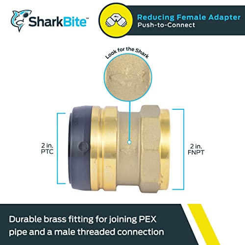 Brass push-to-connect adapter with 2 in. PTC inlet and 2 in. FIP outlet, black grip ring visible.