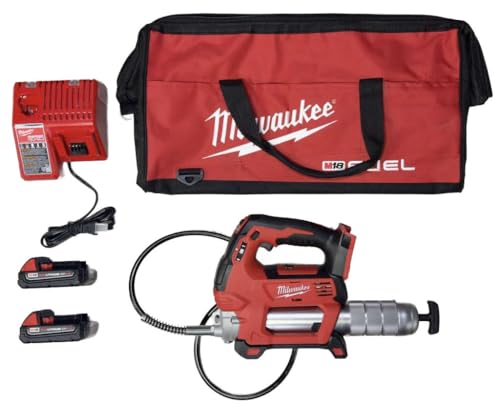Milwaukee M18 grease gun kit with charger, two batteries, carrying bag, and hoses.