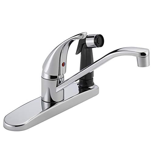 Chrome single handle kitchen faucet with curved spout and detachable spray head on wide base.
