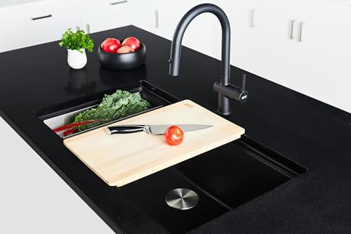 Black undermount granite kitchen sink with single bowl, black pull-down faucet, and cutting board on black countertop.