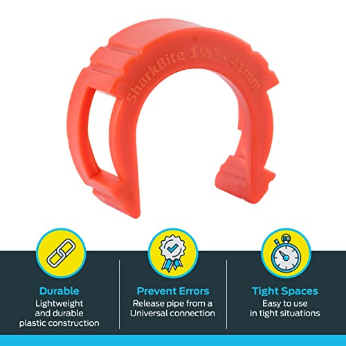 Red plastic push-to-connect disconnect tool with horseshoe shape and side handles for 1-1/2 inch plumbing connections.