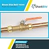 Brass push-to-connect adapter with copper tubing ends and grip rings, SharkBite brand.