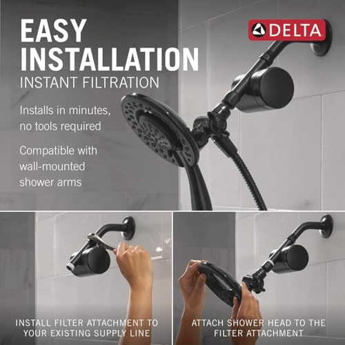 Matte black dual showerhead filter system with adjustable arm and mounting bracket shown installed on tile wall.