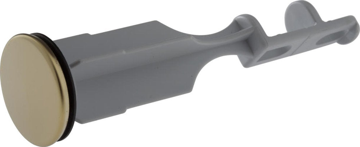 Polished brass drain stopper with gray plastic body and lever handle for bathroom sink.