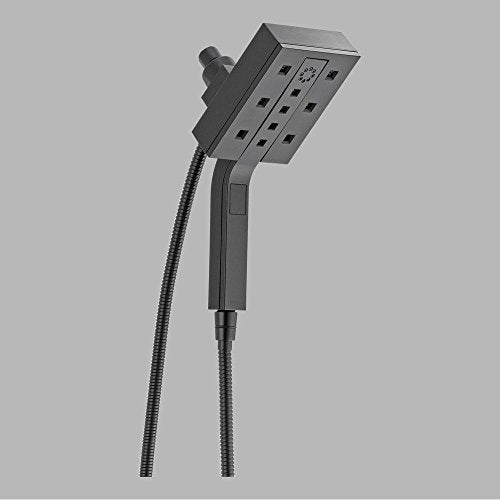 Matte black square shower head with multiple spray nozzles mounted on angled arm with attached flexible hose.