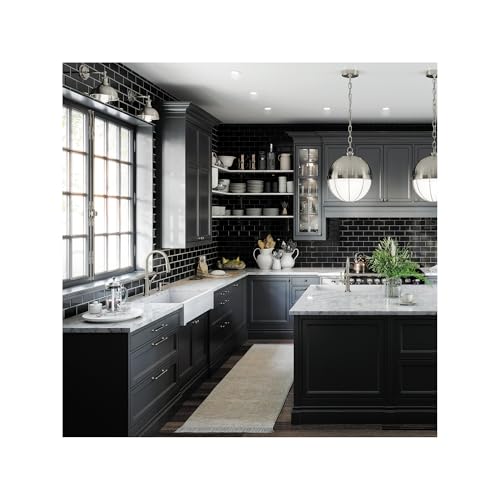 Steel Optic high arc kitchen faucet with pull-down spray head mounted on black cabinet sink in modern kitchen.