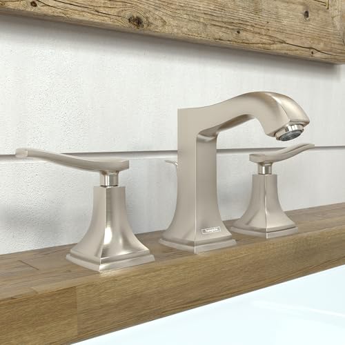 Brushed nickel widespread bathroom faucet with two lever handles and tall curved spout on wooden countertop.