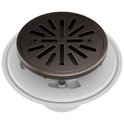 Round shower drain with venetian bronze grate and radial slot pattern, white base collar with mounting hardware visible.