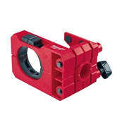 Red Milwaukee HOLE DOZER door lock installation jig with circular opening, adjustment knobs, and mounting hardware.