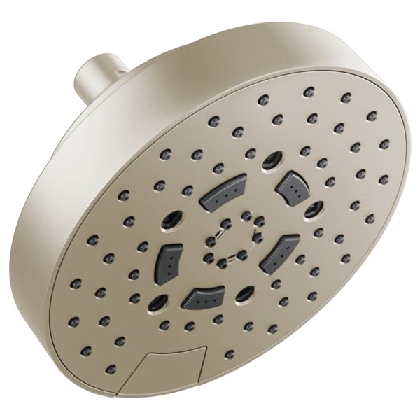 Round brushed nickel shower head with multiple spray jets and function controls mounted on circular face plate.