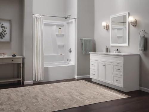 Chrome single handle centerset bathroom faucet mounted on white vanity in modern bathroom.