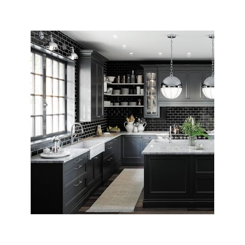 Chrome pull-down kitchen faucet with high arc spout installed in modern black and white kitchen sink.