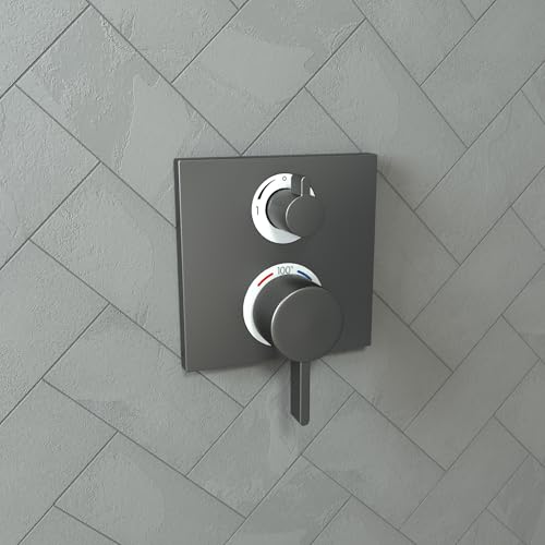 Brushed black chrome square thermostatic valve trim with two circular control knobs mounted on herringbone tile wall.