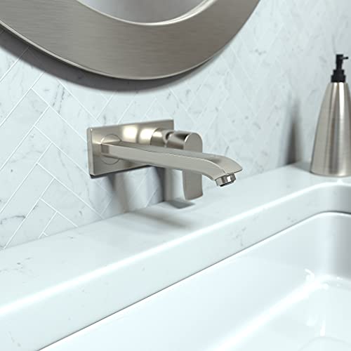 Brushed nickel wall-mounted single-handle faucet trim with curved spout installed above white sink.