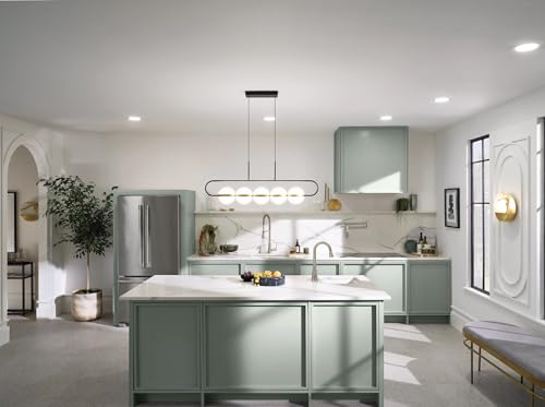 Stainless steel spring pulldown kitchen faucet with single handle mounted on white countertop.