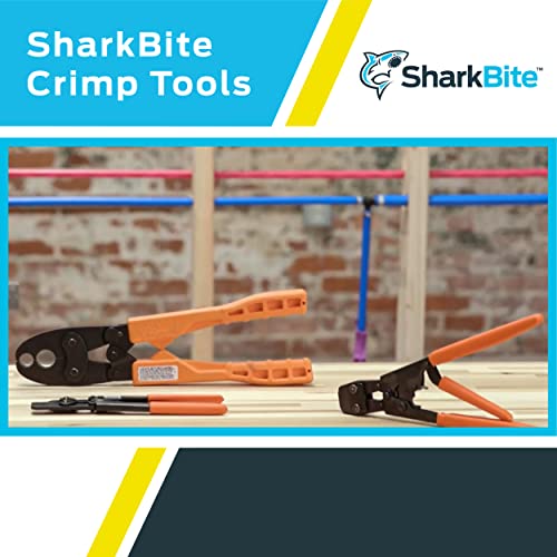 Orange and black SharkBite crimp ring removal tool with handles shown in plumbing work setting.